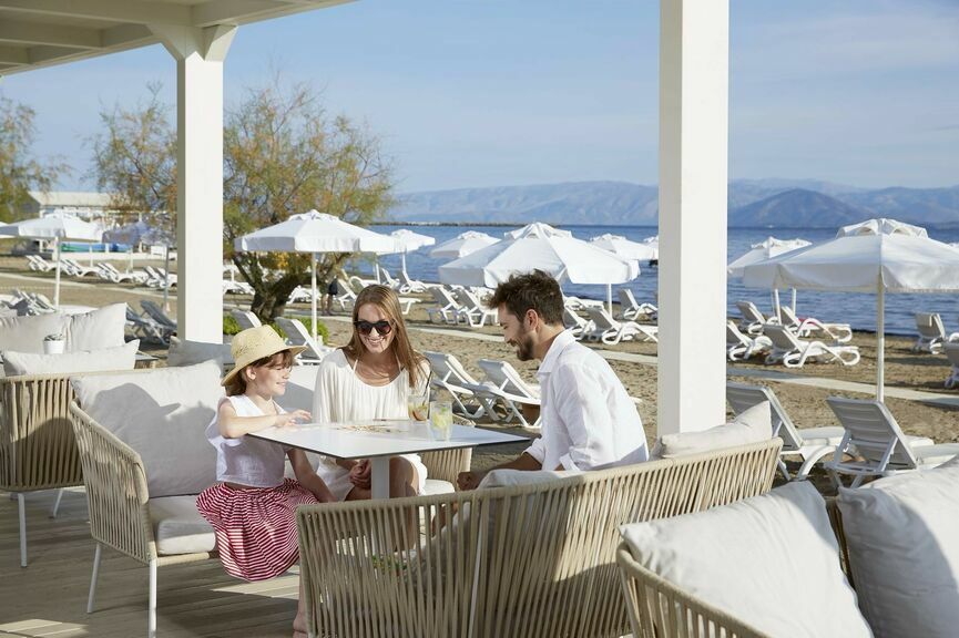 Family of three enjoying moments together at Capo Di Corfu with our Corfu holiday deals for families